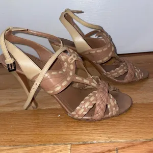 ALAÏA Leather Sandals in nude