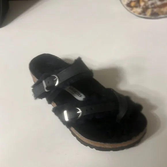 Birkenstock Mayari oiled leather shearling sandals.