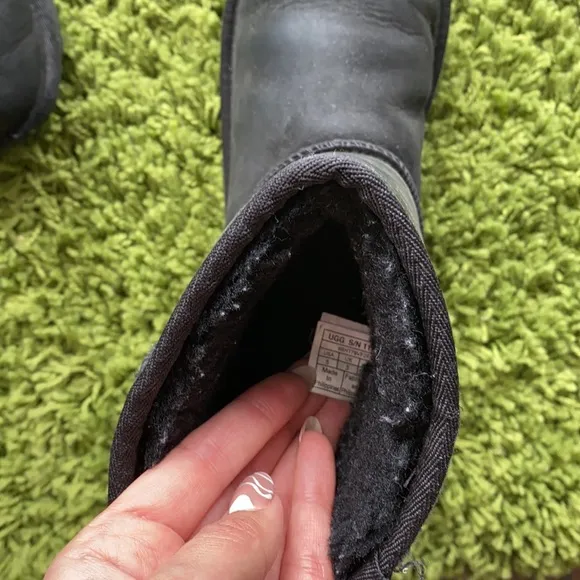 UGG black waterproof boots for a boy or a girl.