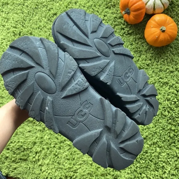 UGG black waterproof boots for a boy or a girl.