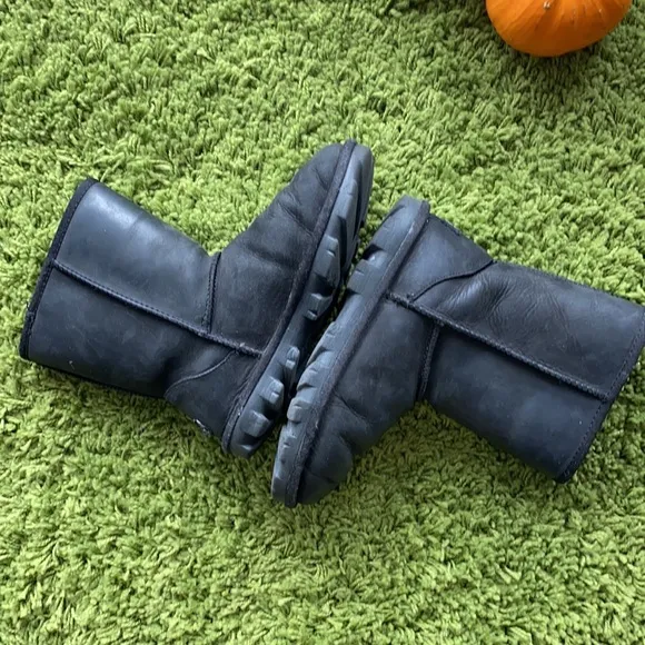 UGG black waterproof boots for a boy or a girl.