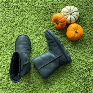 UGG black waterproof boots for a boy or a girl.